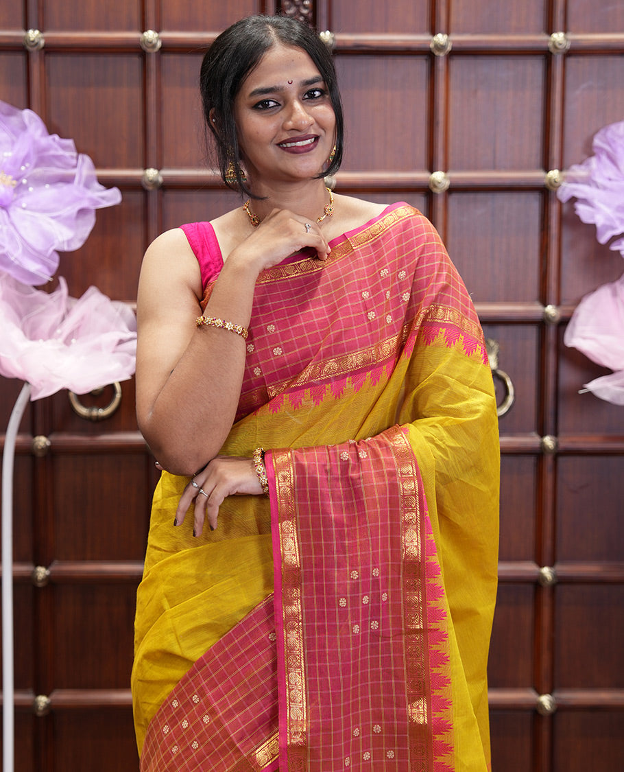 Yellow Plain Chettinad Cotton Saree, Complemented by Contrast Traditional Temple Border of Butta Enclosed Checks, Subtly Striped Pallu, and Paired with a Matching Blouse