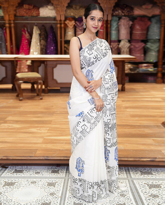 White peacock block printed mul cotton saree, geometric printed border, geometric printed pallu, and a matching block printed blouse