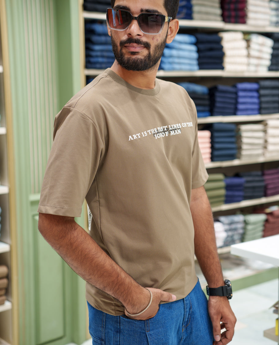 Brown Cotton-Blended T-shirt, Comes with a Unique Back Print, Half-sleeves, Crew Neck, Oversized Fit, and Regular Length 