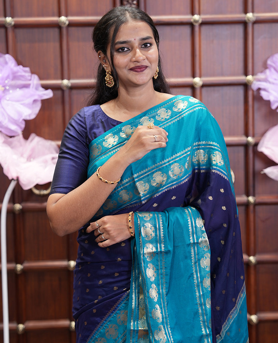 Navy Blue Art Mysore Silk Saree, Elevated with Zari Buttas All Over Its Body, Complemented by a Contrast Rettai Pettu Border of Two-Headed Eagle Designs, Pallu Steeped with Buttas and Stripes, and Paired with a Contrast Blouse