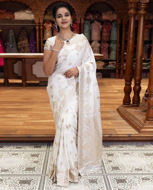 Borderless white zari buttas and diamond buttas mushru silk saree, intricately designed pallu, and a matching blouse