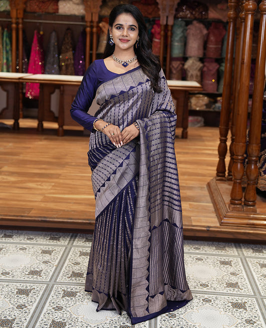 Navy blue zari geometric fancy crepe saree, temple zari border, zari striped pallu, and a matching buttas woven blouse