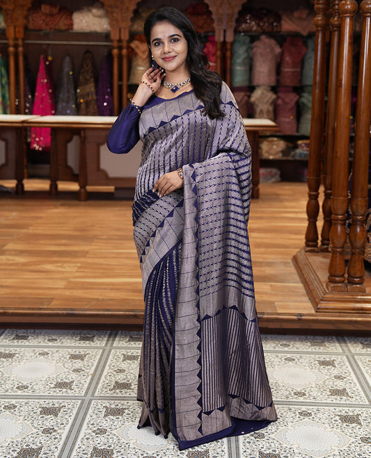 Navy blue zari geometric fancy crepe saree, temple zari border, zari striped pallu, and a matching buttas woven blouse