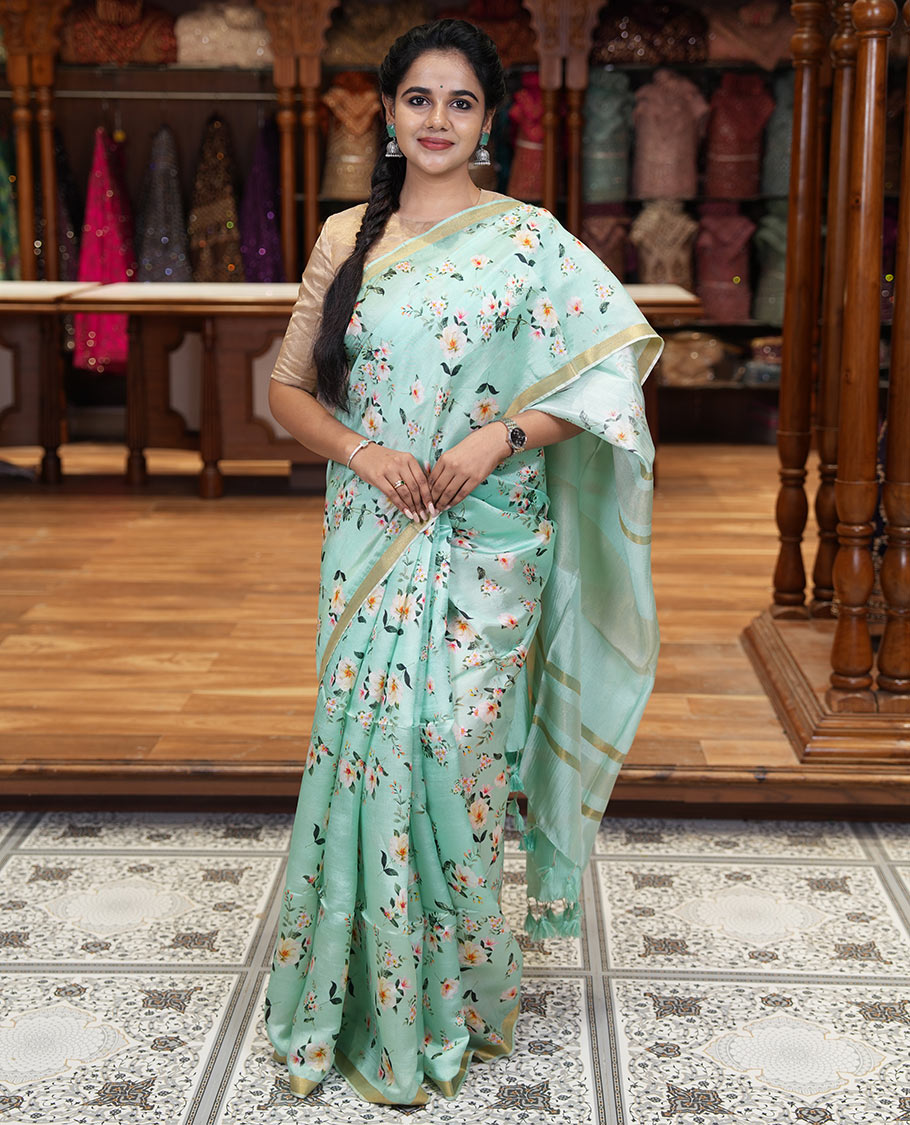Mint green floral motifs digital printed banana pith saree, piping border, striped pallu, and floral printed blouse