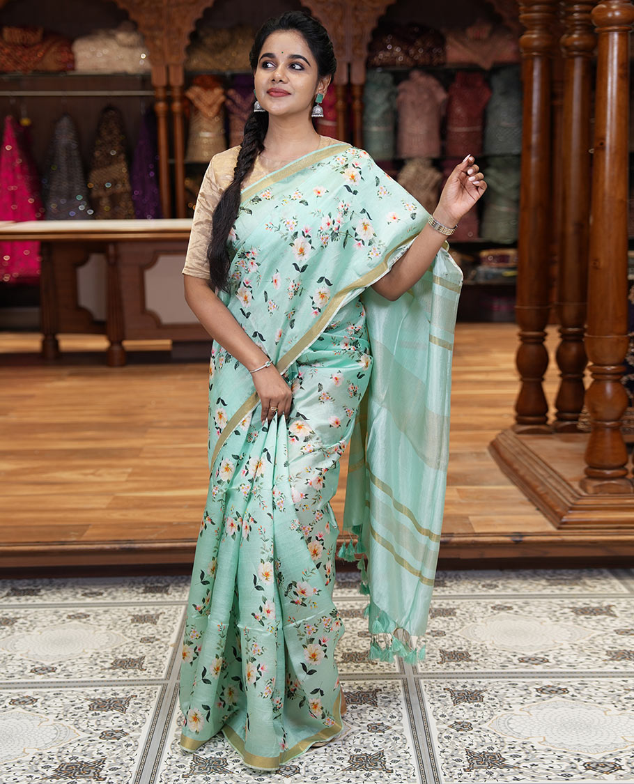 Mint green floral motifs digital printed banana pith saree, piping border, striped pallu, and floral printed blouse