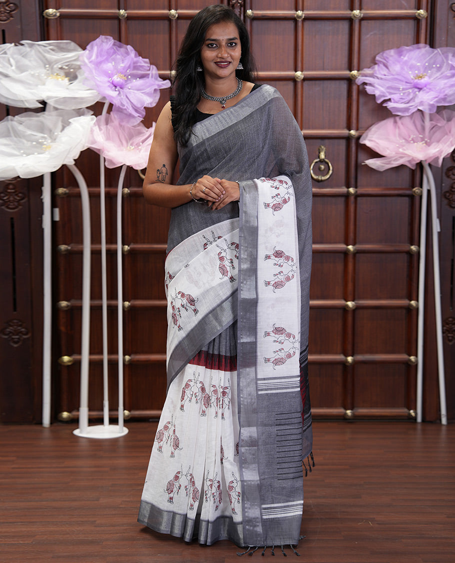 Cream and Grey Linen Cotton Saree, Subtly Sparkled with Half-and-Half Style and Elephant Motifs Printed On Its Body, Highlighted by Zari Border, Pallu of Same Print, and Paired with a Printed Blouse