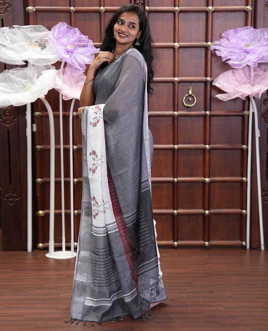 Cream and Grey Linen Cotton Saree, Subtly Sparkled with Half-and-Half Style and Elephant Motifs Printed On Its Body, Highlighted by Zari Border, Pallu of Same Print, and Paired with a Printed Blouse