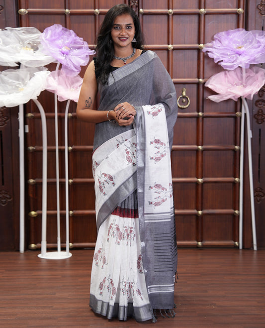Cream and Grey Linen Cotton Saree, Subtly Sparkled with Half-and-Half Style and Elephant Motifs Printed On Its Body, Highlighted by Zari Border, Pallu of Same Print, and Paired with a Printed Blouse
