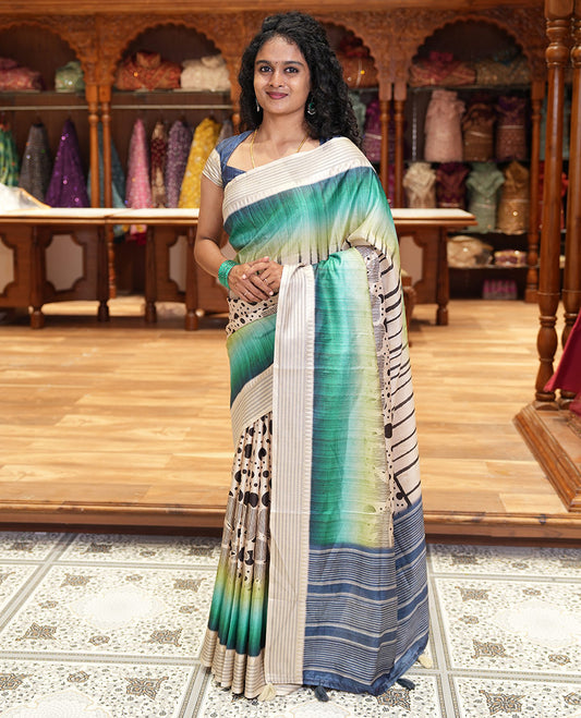 Rama green geometric patterns and polka dots printed semi-tussar saree, contrast horizontal striped zari border, striped pallu, and a contrast blouse