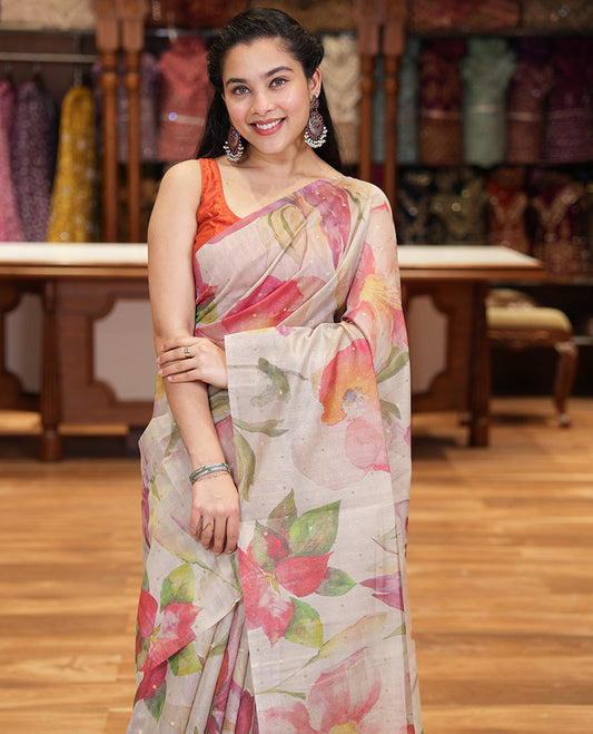 Borderless chikku-base colorful floral printed with buttas fancy tussar saree with a matching printed and zari work blouse