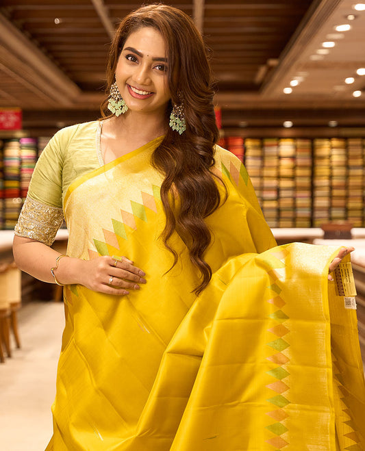 Yellow malli mokku buttas kancheepuram silk saree, meenakari temple zari border & pallu of chakram & jaal designs