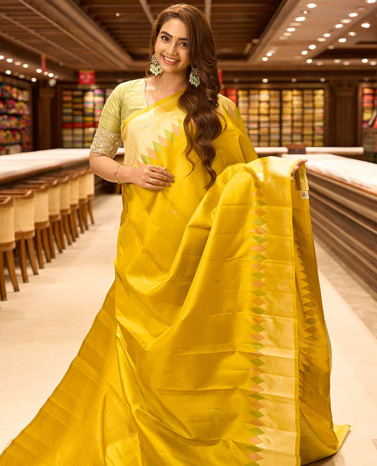 Yellow malli mokku buttas kancheepuram silk saree, meenakari temple zari border & pallu of chakram & jaal designs