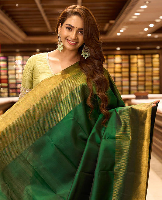 Green plain design kancheepuram silk saree, seppu rekku zari border & thick zari design weave pallu