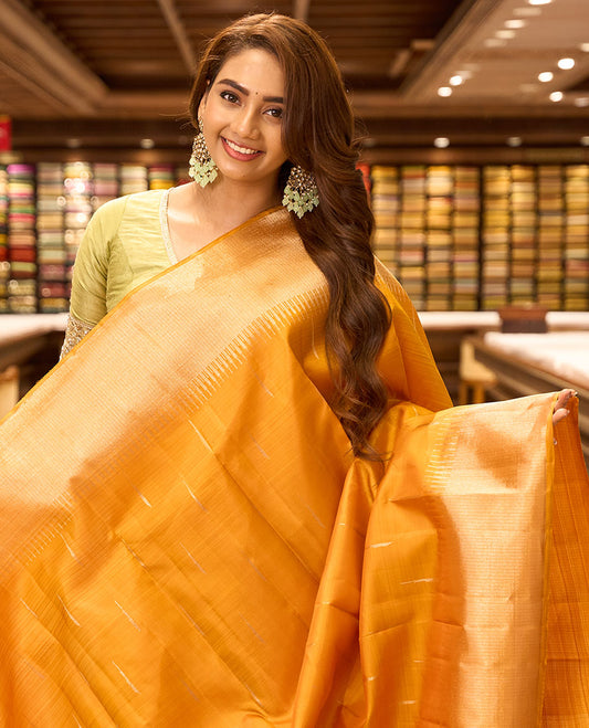 Orange malli mokku kancheepuram silk saree, thazampoo rekku zari border & zari-rich striped pallu