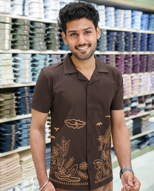 Brown Cotton-Blended Casual Shirt Comes with a Tropical Floral Embroidery, a Cuban Collar Neck, Half Sleeves, a Regular Fit, and Regular Length