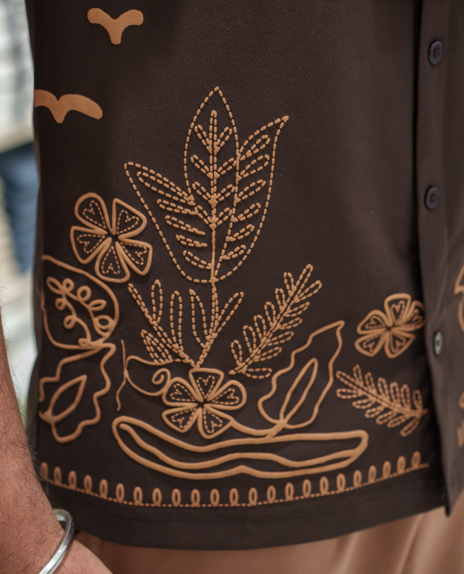 Brown Cotton-Blended Casual Shirt Comes with a Tropical Floral Embroidery, a Cuban Collar Neck, Half Sleeves, a Regular Fit, and Regular Length