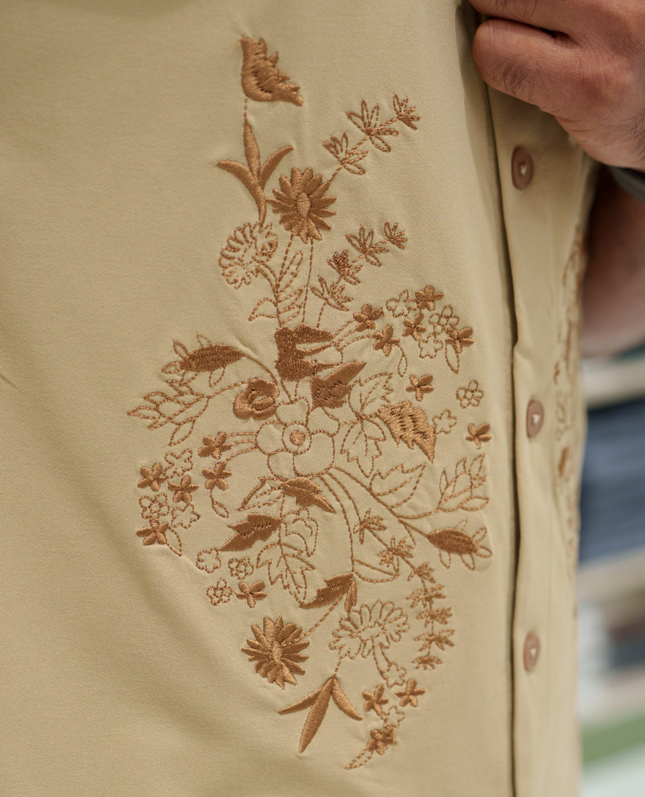 Cream Cotton-Blended Casual Shirt Comes with a Floral Embroidery, a Cuban Collar Neck, Half Sleeves, a Regular Fit, and Regular Length
