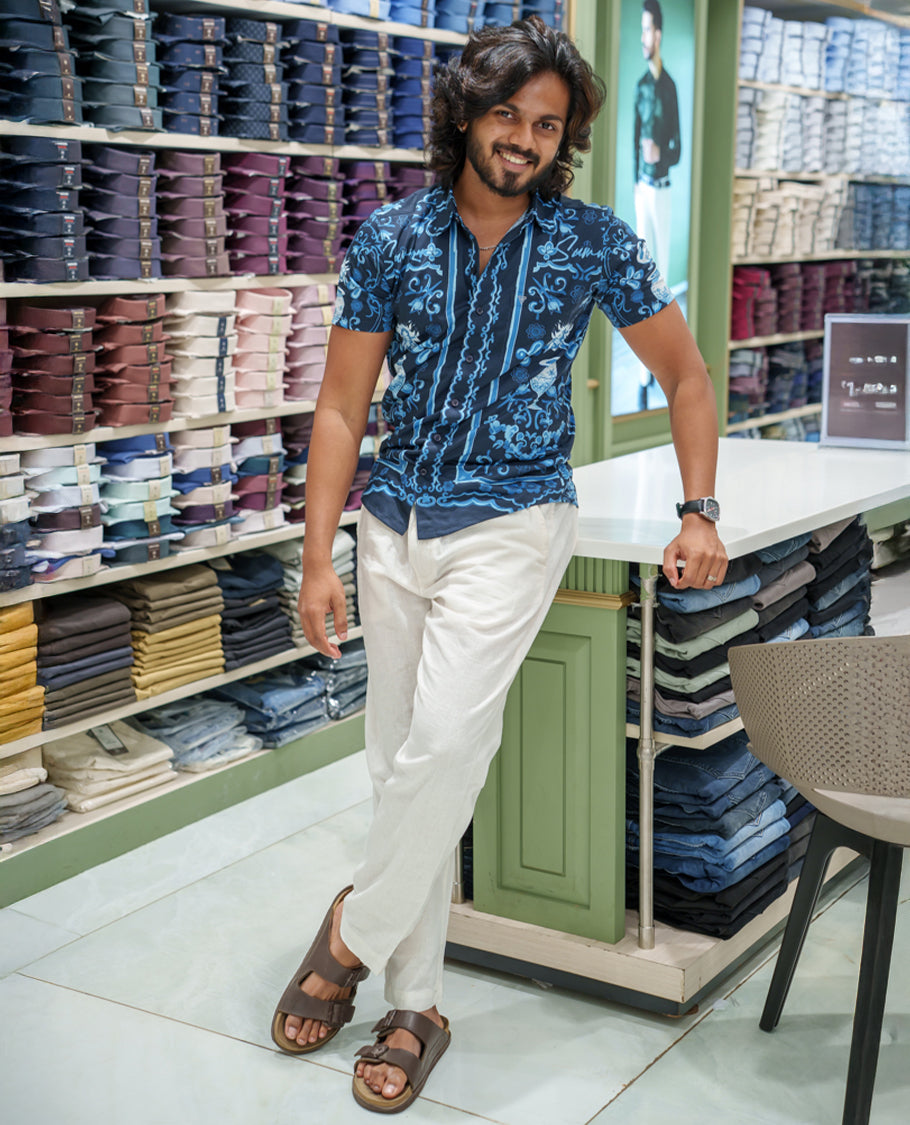 Navy Blue Cotton-Blended Casual Shirt Comes with Floral-Flower Vase Motifs Print, Spread Collar, Half Sleeves, Regular Fit, and Regular Length