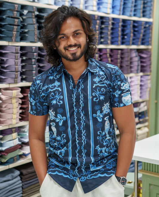Navy Blue Cotton-Blended Casual Shirt Comes with Floral-Flower Vase Motifs Print, Spread Collar, Half Sleeves, Regular Fit, and Regular Length