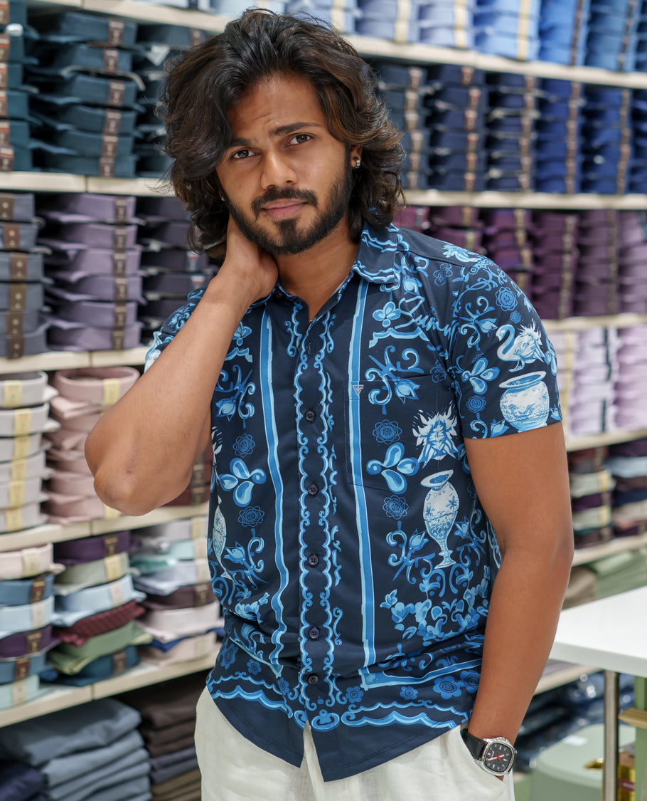 Navy Blue Cotton-Blended Casual Shirt Comes with Floral-Flower Vase Motifs Print, Spread Collar, Half Sleeves, Regular Fit, and Regular Length