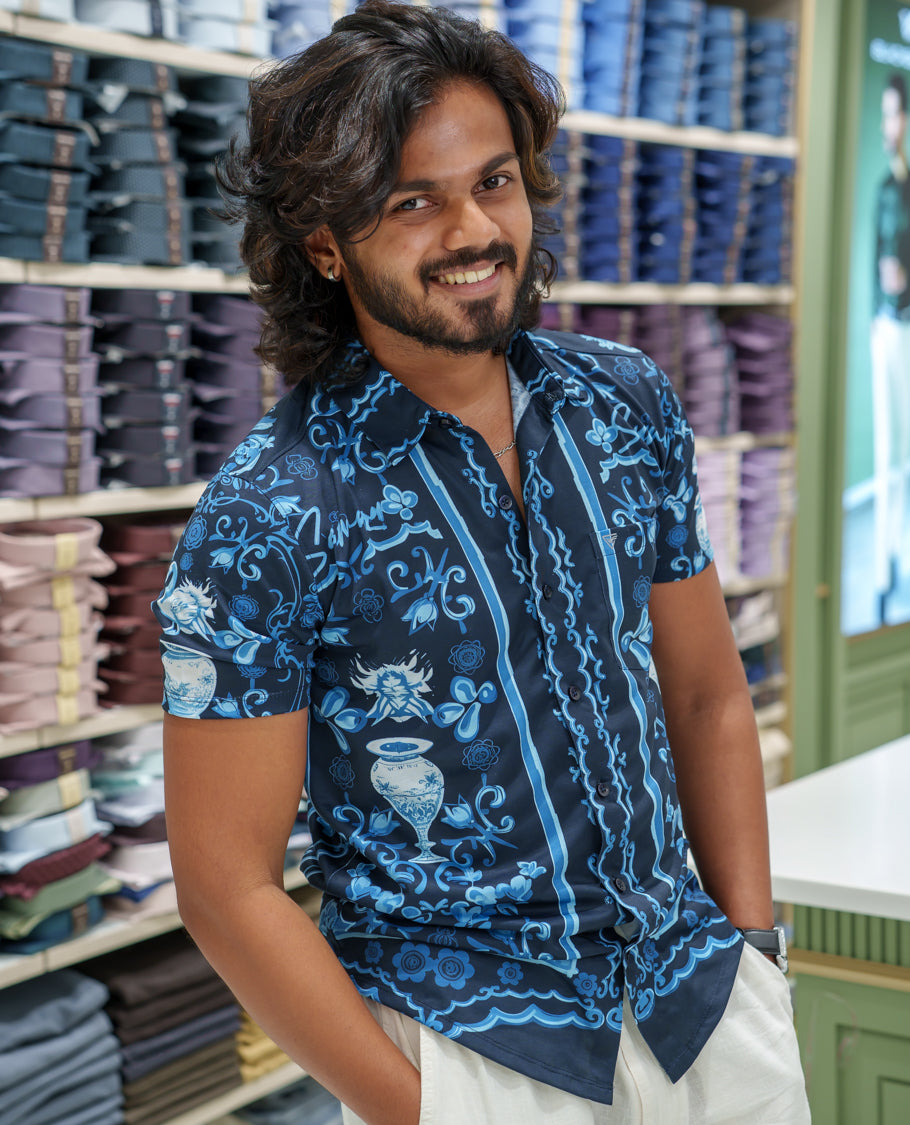 Navy Blue Cotton-Blended Casual Shirt Comes with Floral-Flower Vase Motifs Print, Spread Collar, Half Sleeves, Regular Fit, and Regular Length
