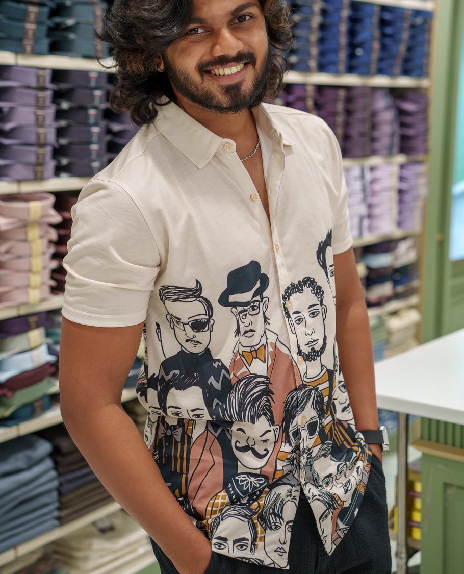 White Cotton-Blended Casual Shirt Comes with Human Figurines Print, Spread Collar, Half Sleeves, Regular Fit, and Regular Length