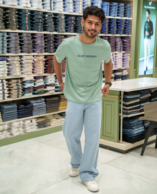 Green Cotton-Blended T-Shirt Comes with an Tree-Motifs Back Print, Crew Neck, Half Sleeves, Oversized Fit, and Regular Length