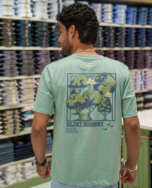 Green Cotton-Blended T-Shirt Comes with an Tree-Motifs Back Print, Crew Neck, Half Sleeves, Oversized Fit, and Regular Length