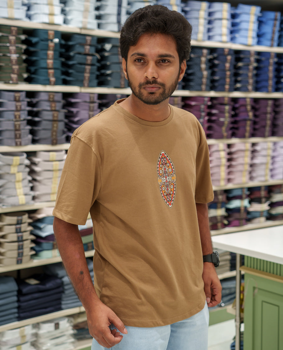 Brown Cotton-Blended T-Shirt Comes with an Evil-Themed Back Print, Crew Neck, Half Sleeves, Oversized Fit, and Regular Length