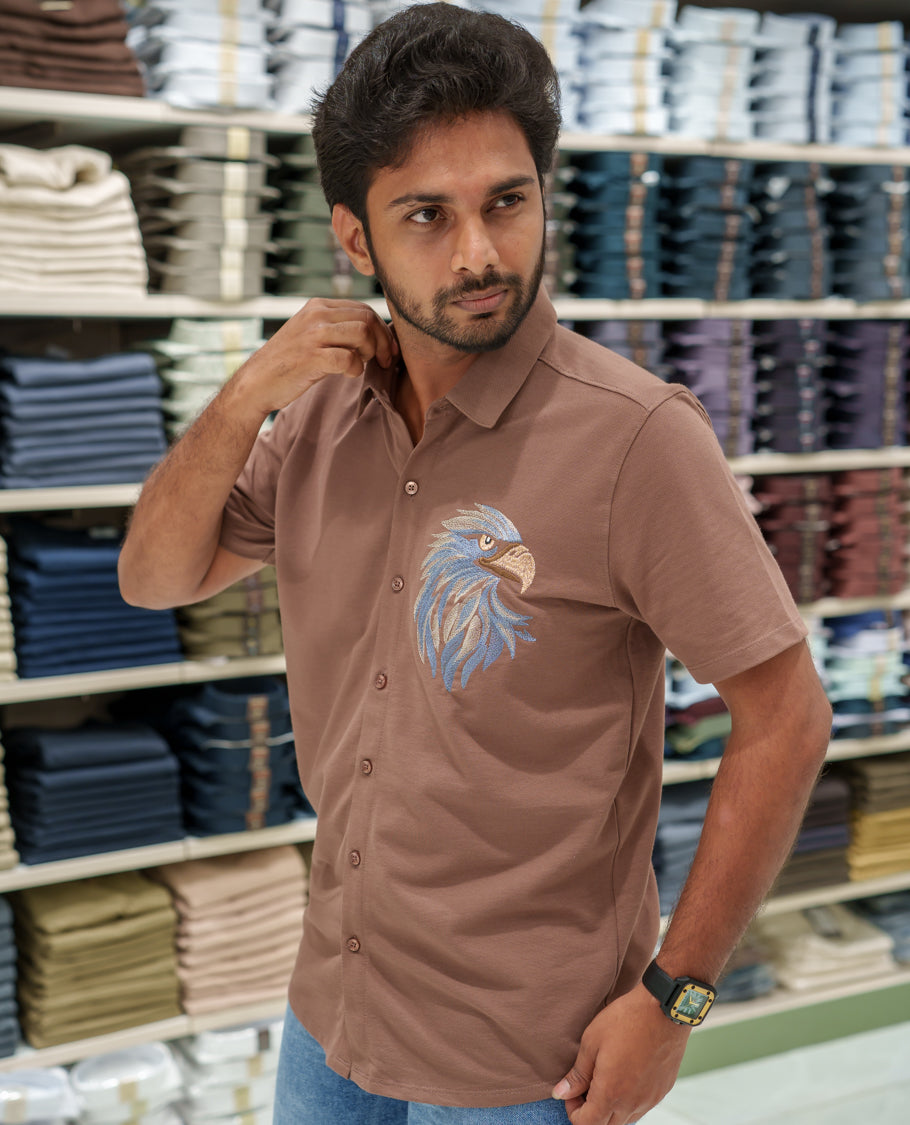 Brown Cotton-Blended Casual Shirt Comes with Eagle Motif Embroidery, Spread Collar, Half Sleeves, Regular Fit, and Regular Length