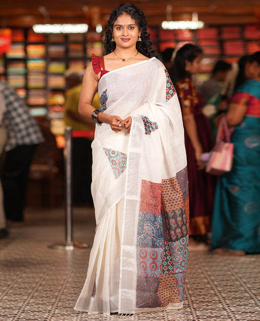 Cream Linen Cotton Saree, Gleamed Up with Triangle Motifs Print, a Zari Border, Printed Pallu, and a Contrast Blouse