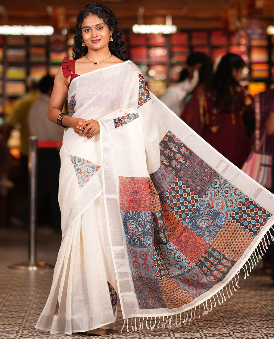 Cream Linen Cotton Saree, Gleamed Up with Triangle Motifs Print, a Zari Border, Printed Pallu, and a Contrast Blouse