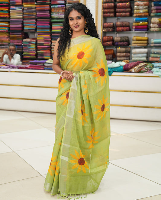 Green Linen Cotton Saree, Beautified with Sunflower Print, a Zari Border, and a Matching Blouse