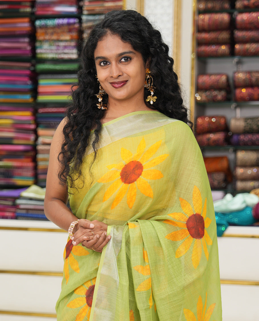 Green Linen Cotton Saree, Beautified with Sunflower Print, a Zari Border, and a Matching Blouse