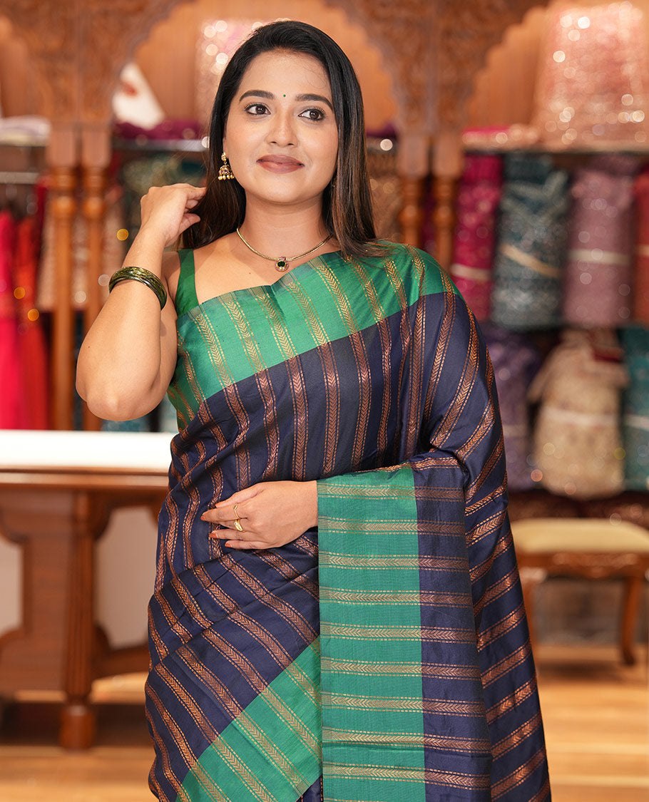 Navy Blue Semi-Soft Silk Saree, Elevated with Chevron Stripes, Complemented by a Contrast Zari Striped Border, and a Contrast Blouse