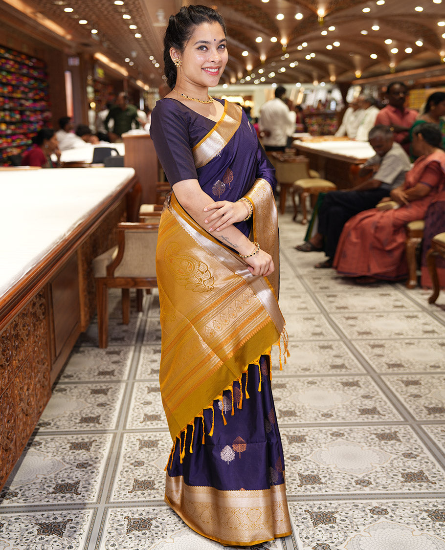 Dark Violet Semi-Soft Silk Saree, Embellished with Tree Zari Buttas All Over Its Body, Complemented by a Contrast Traditional Zari Design Border, Pallu of Paisleys, and Paired with a Contrast Blouse