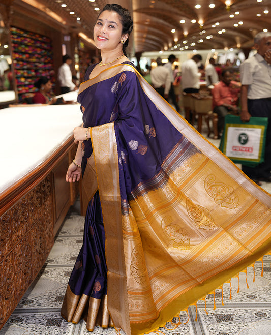 Dark Violet Semi-Soft Silk Saree, Embellished with Tree Zari Buttas All Over Its Body, Complemented by a Contrast Traditional Zari Design Border, Pallu of Paisleys, and Paired with a Contrast Blouse