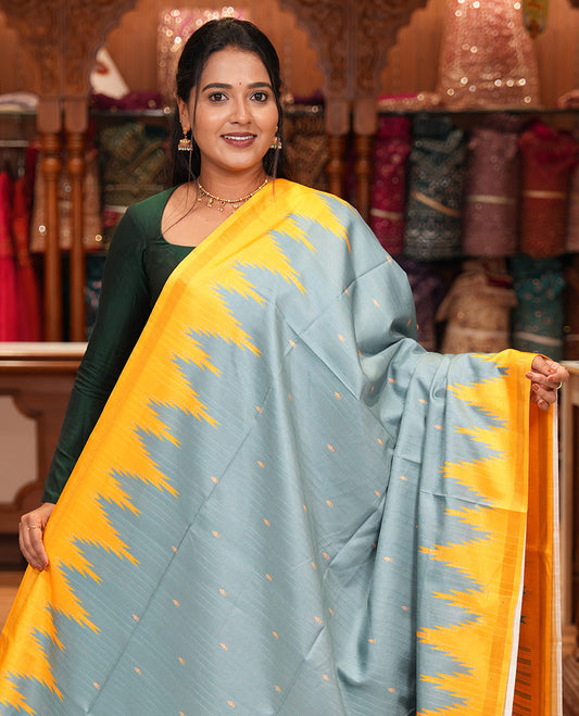Teal Green Katan Silk Saree Features Buttas, Complemented by Contrast Temple Zari Border, Striped Pallu, and a Contrast Blouse