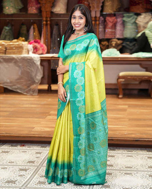 Parrot green floral buttas katan silk saree, contrast floral motifs border, pallu adorned with floral designs, and a contrast lotus flower printed blouse