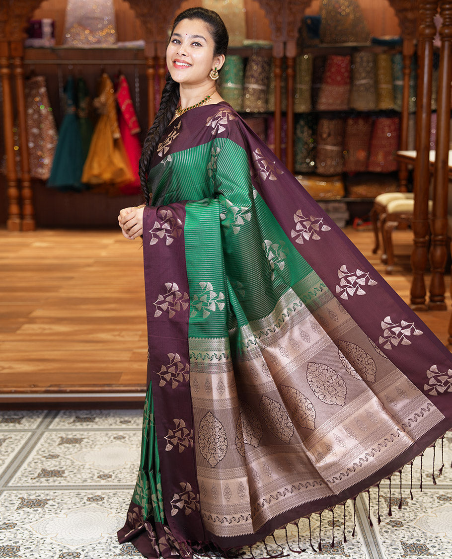 Dark Green Semi-Soft Silk Saree, Highlighted by Vaira Oosai Stripes and Floral Buttas All Over Its Body, Complemented by a Contrast Floral Buttas Border, an Intricately Designed Pallu, and Paired with a  Contrast Blouse