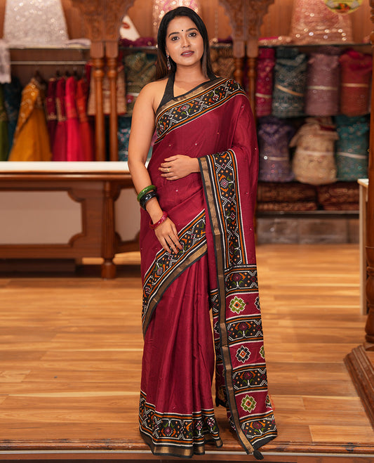 Maroon Manipuri Tussar Saree Features Mirror Work, Contrast Patola Elephant Printed Border, Patola Pallu, Matching Blouse