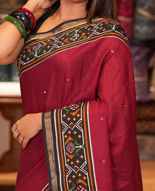 Maroon Manipuri Tussar Saree Features Mirror Work, Contrast Patola Elephant Printed Border, Patola Pallu, Matching Blouse