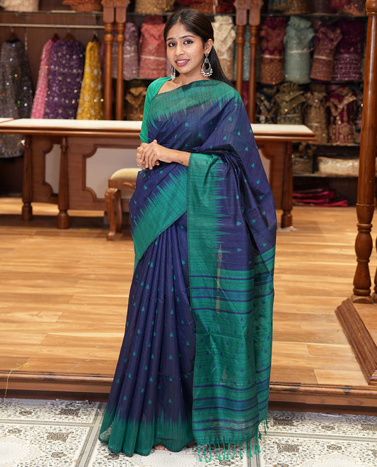 Navy blue buttas semi-jute saree with contrast temple border, thread striped pallu, and a contrast thread buttas blouse