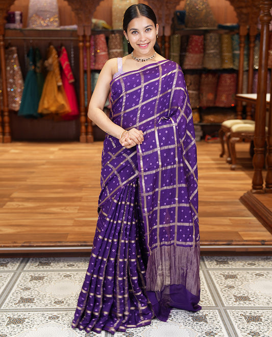 Borderless Purple Assam Silk Saree, Richly Detailed with Bandhani-Dotted Ghar Chola Design on Its Body, Gleaming Zari Pallu, and Paired with a Matching Blouse