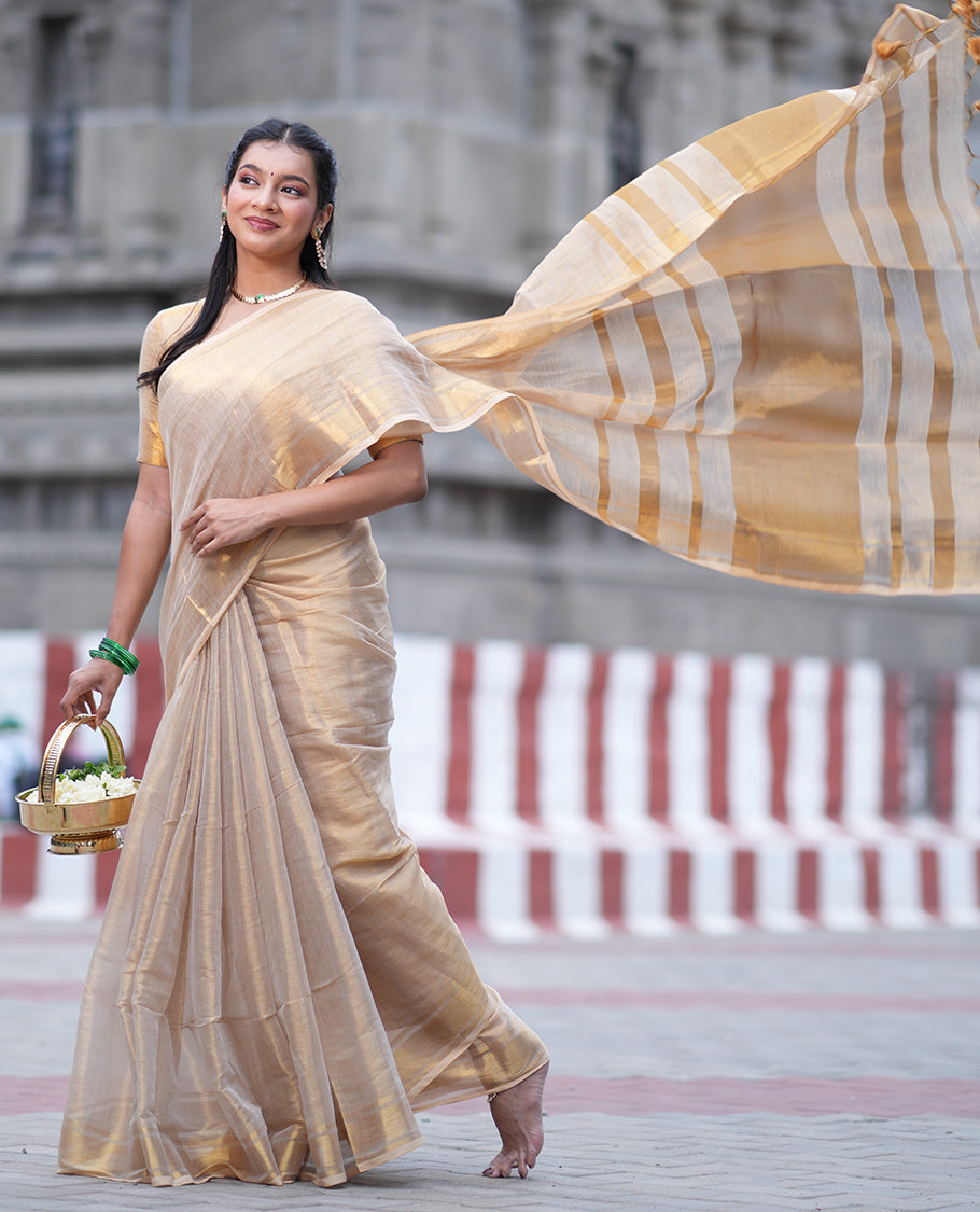 Gold Plain Tissue Mul Cotton Saree, Subtly Sparkled with Zari Border, Gleaming Zari Woven Pallu, and Paired with a Matching Blouse