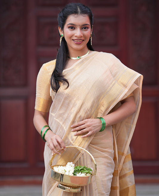 Gold Plain Tissue Mul Cotton Saree, Subtly Sparkled with Zari Border, Gleaming Zari Woven Pallu, and Paired with a Matching Blouse