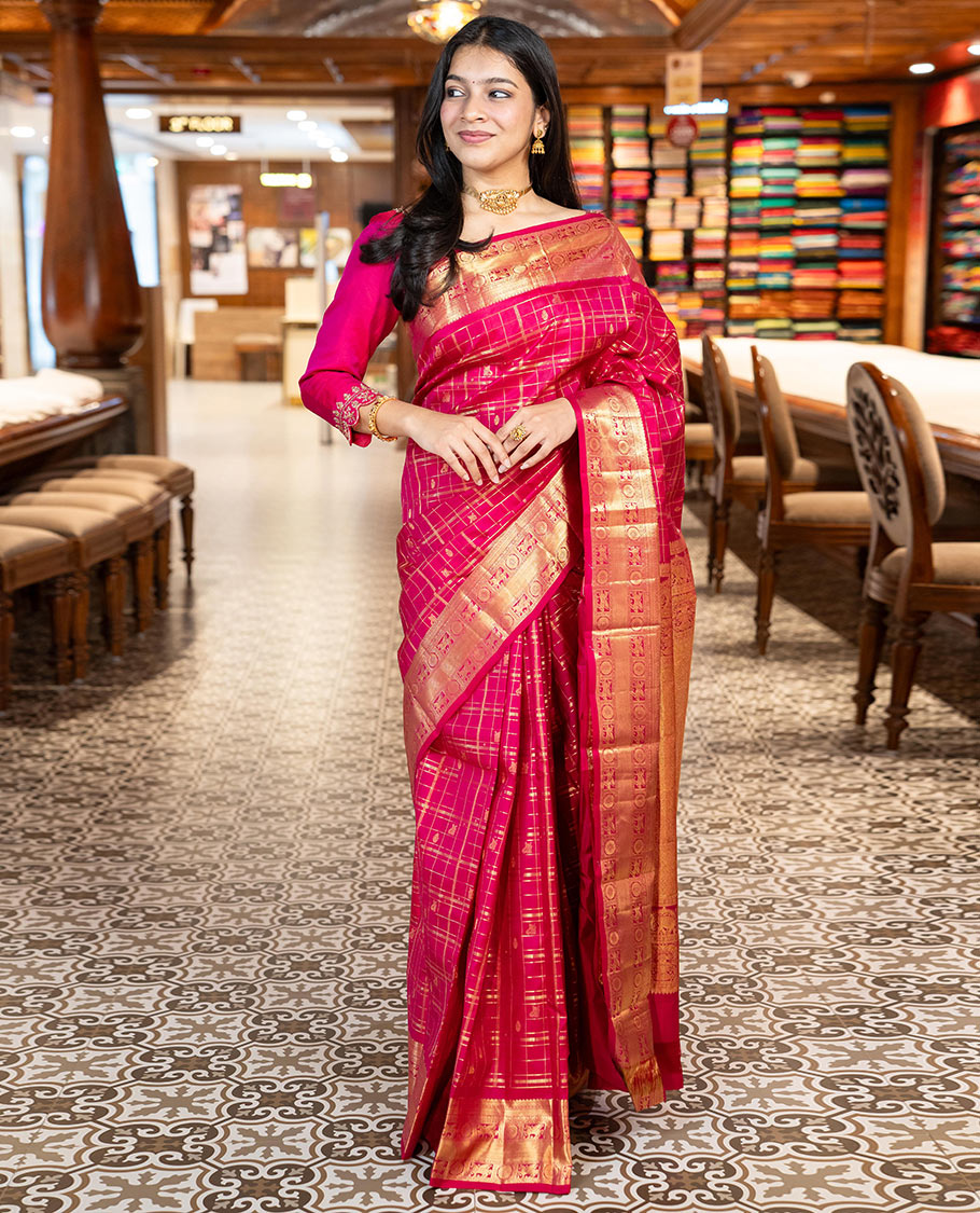 Pink Vasundhara Silk Saree Gracefully Embellished with Zari Butta Enclosed Checks, Complemented with a Zari Border of Kuthirai and Chakram Designs, Pallu of Intricate Zari-Weave, and Paired with a Matching Blouse