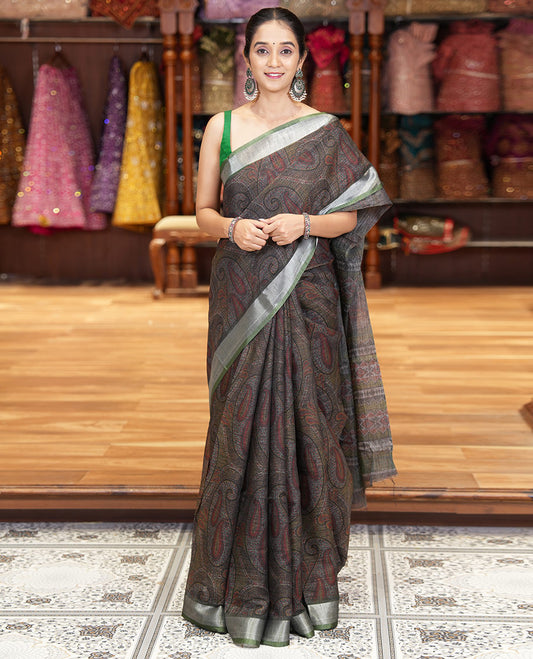 Black Printed Linen Cotton Saree Embellished with Paisley Motifs, Complemented by a Contrast Bavanji Border, Featuring Paisley Printed Pallu, Paired with a Subtle Matching Blouse