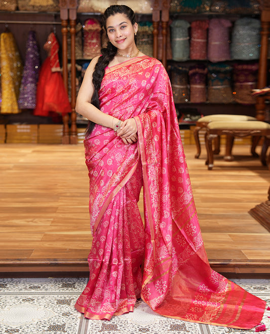 Pink Banana Pith Saree Accentuated with Floral Motifs Discharge Print All Over Its Body, Zari Bavanji Border, Pallu Subtly Woven in Floral Print and Zari Weave, and Paired with a Matching Blouse