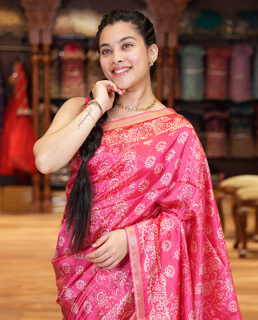 Pink Banana Pith Saree Accentuated with Floral Motifs Discharge Print All Over Its Body, Zari Bavanji Border, Pallu Subtly Woven in Floral Print and Zari Weave, and Paired with a Matching Blouse